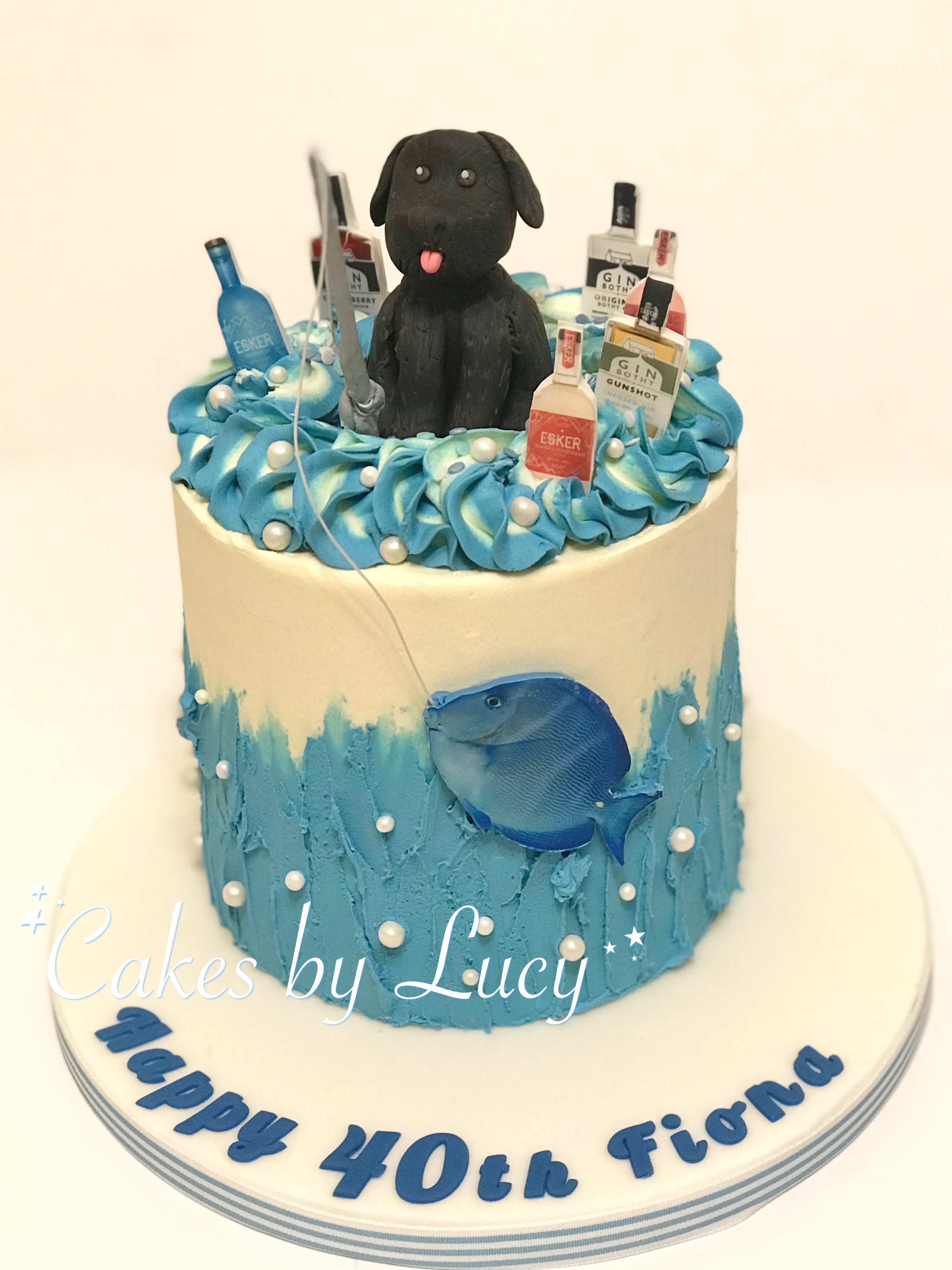 Fishing and gin themed cake with dog model