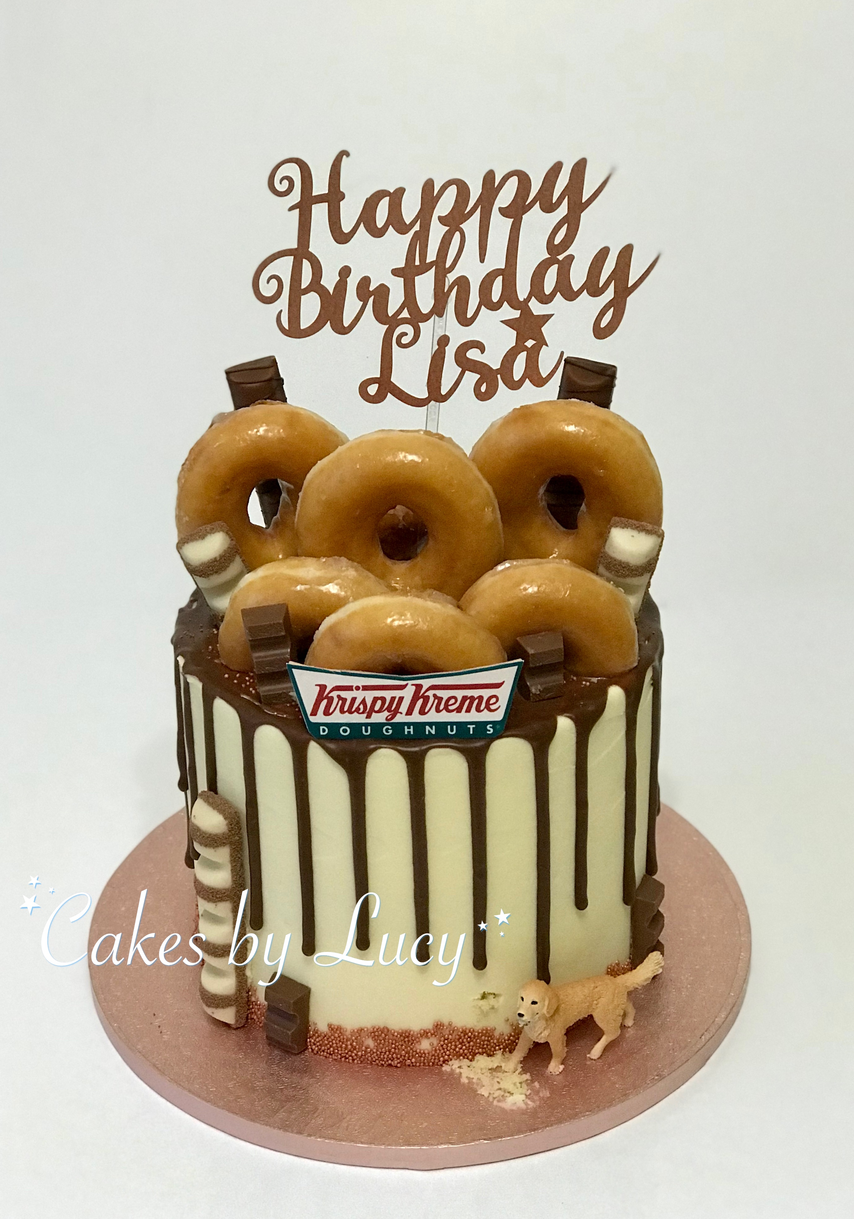 Kristy Kreme donuts on chocolate drip cake