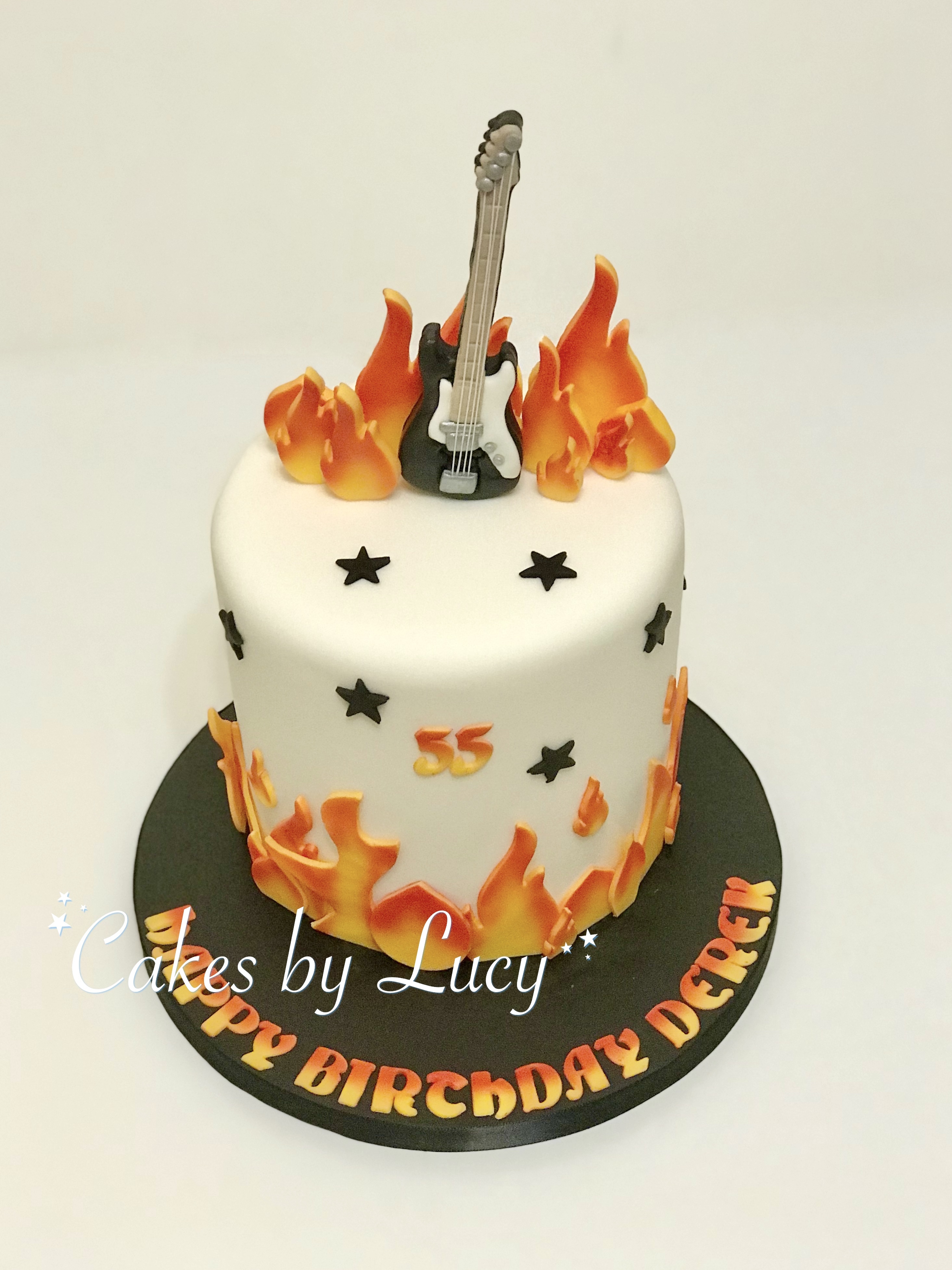 Rock music cake with model bass guitar