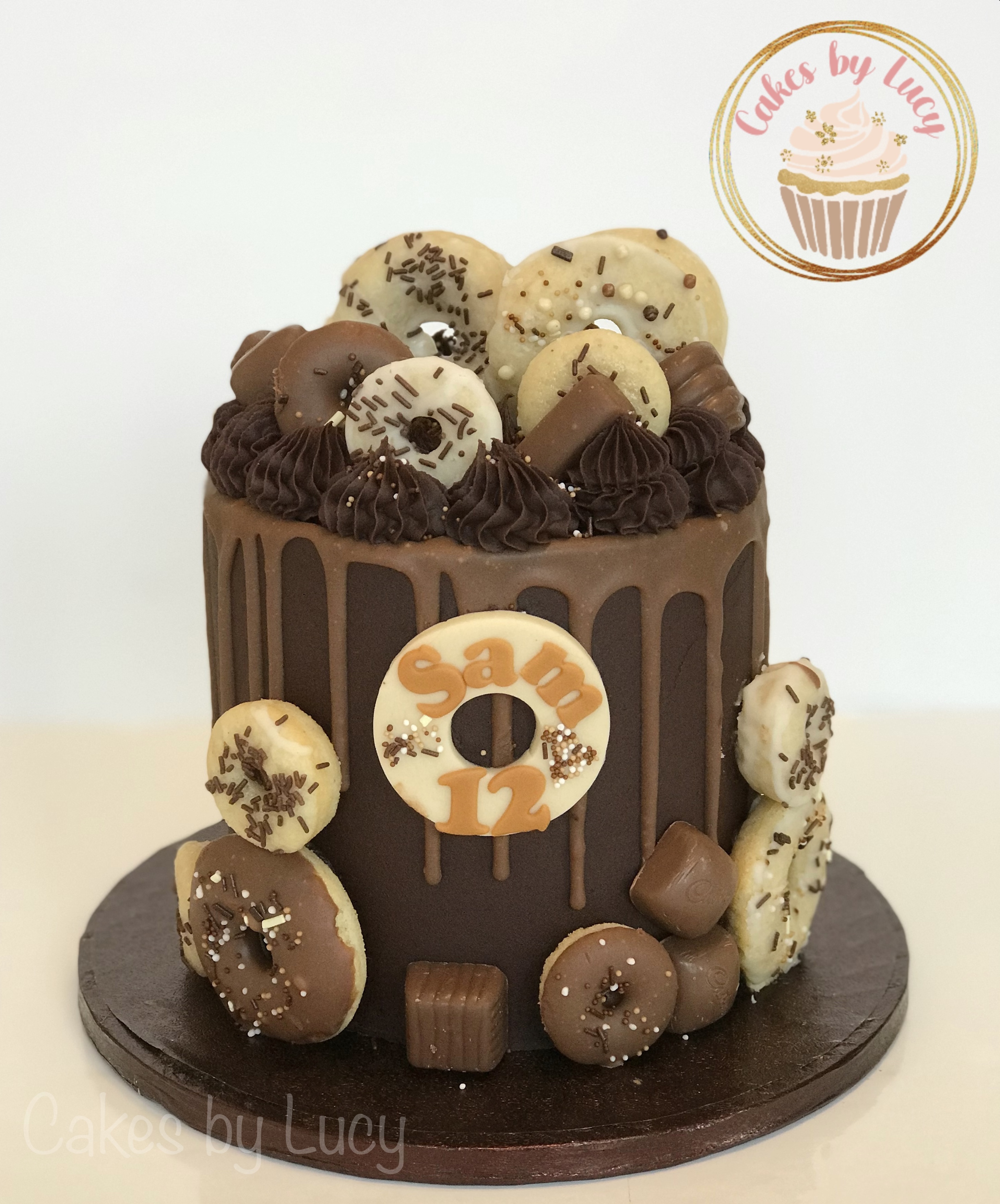 Chocolate drip cake with doughnuts